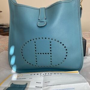 Hemes Evelyn 1 GM in Blue Jean Courchevel 12”x12”x4” Gold hardware